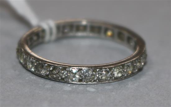 A white metal and diamond full eternity ring, size Q.